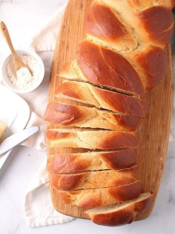 Loaf of vegan challah on cutting board