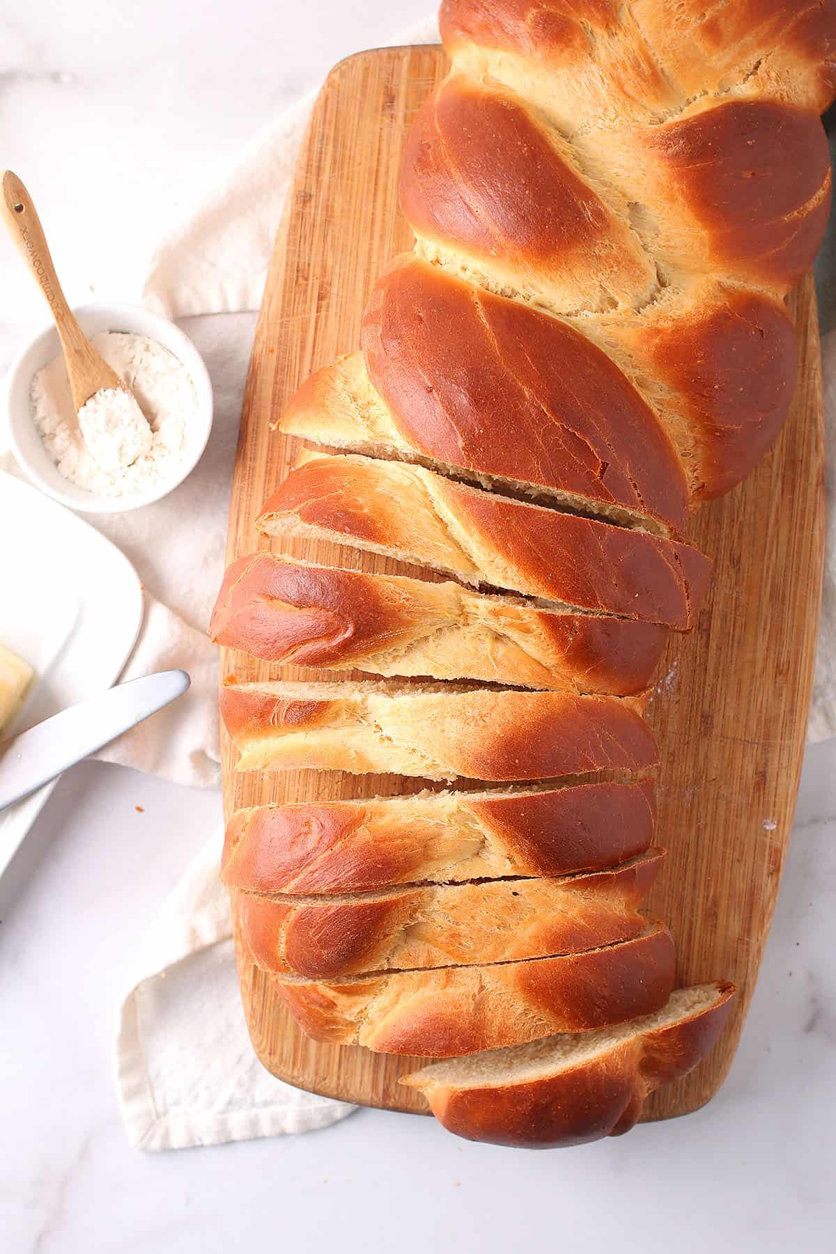 Loaf of vegan challah on cutting board