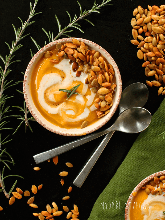 Curried Pumpkin Soup in a white bowl with two spoons