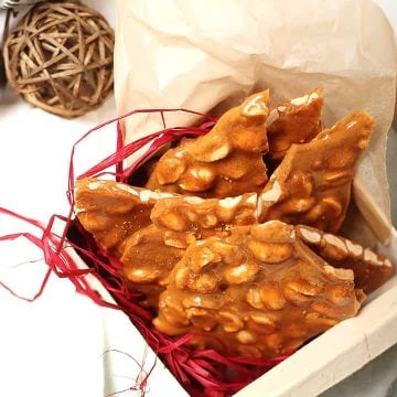 Homemade peanut brittle in a gift box