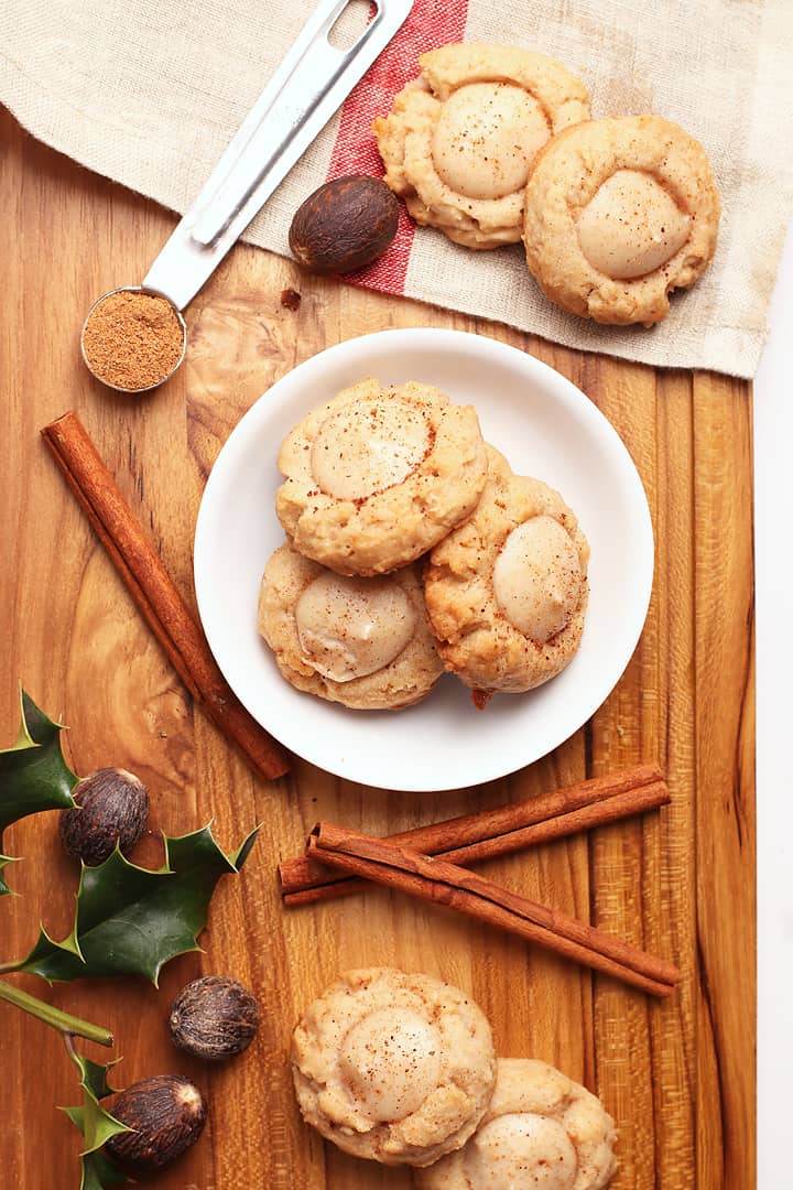 Vegan Thumbprint Cookies on a wooden platter with spices