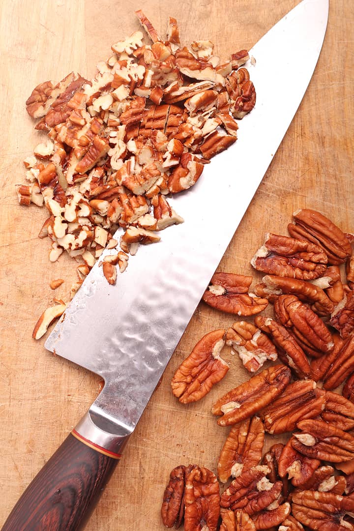 Chopped pecans on cutting board