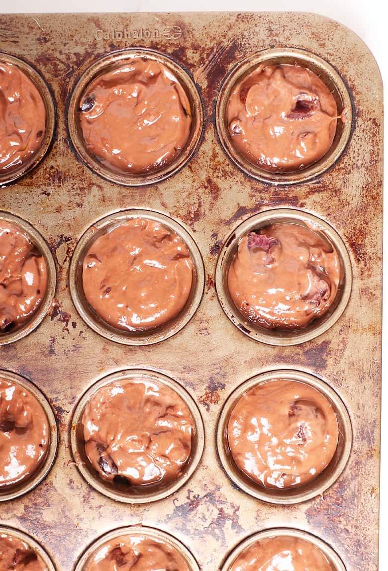 Muffin batter in a muffin tin