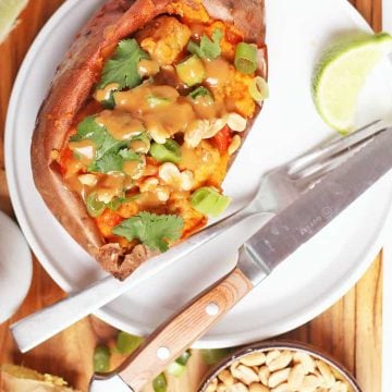 Vegan stuffed sweet potatoes on white plate