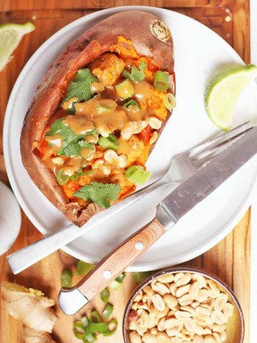 Vegan stuffed sweet potatoes on white plate