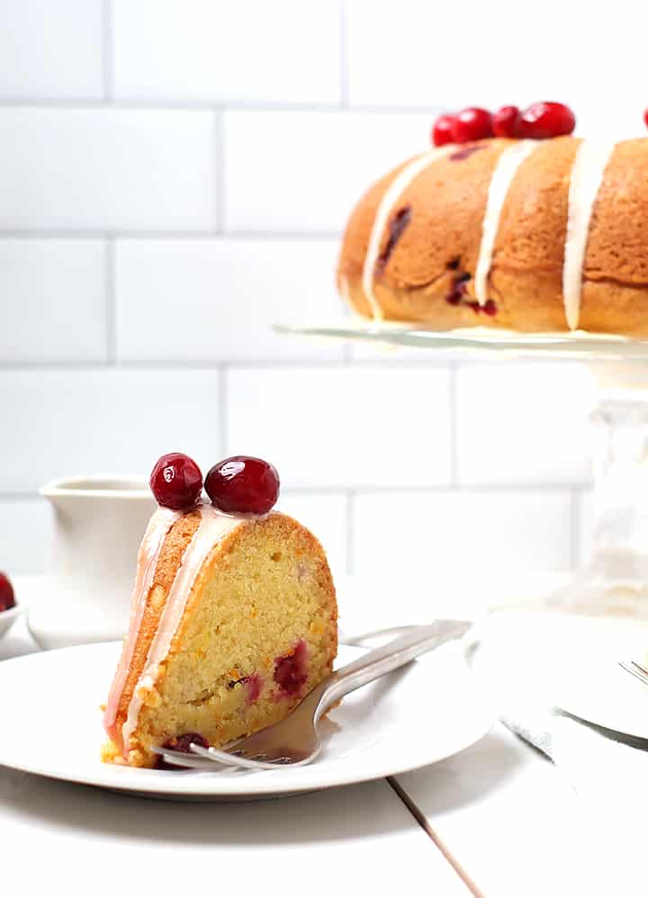 Slice of Cranberry Orange Pound Cake on white plate