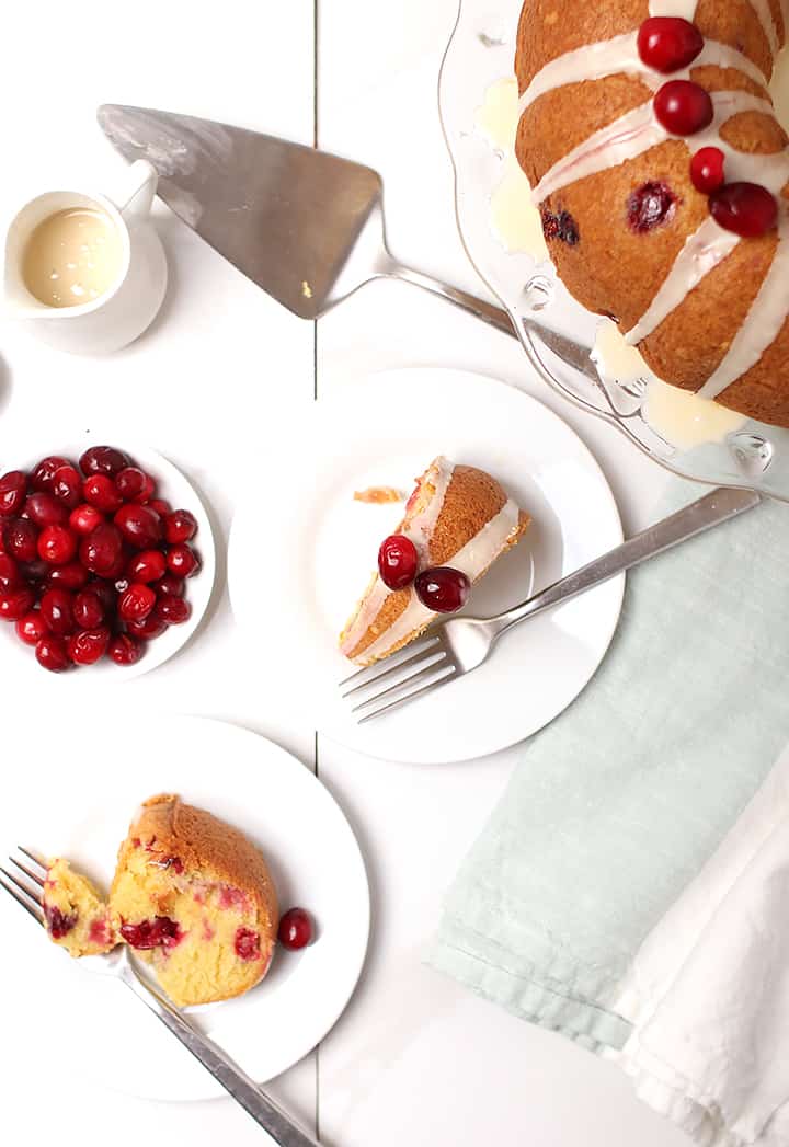 Two slices of vegan pound cake on white plates