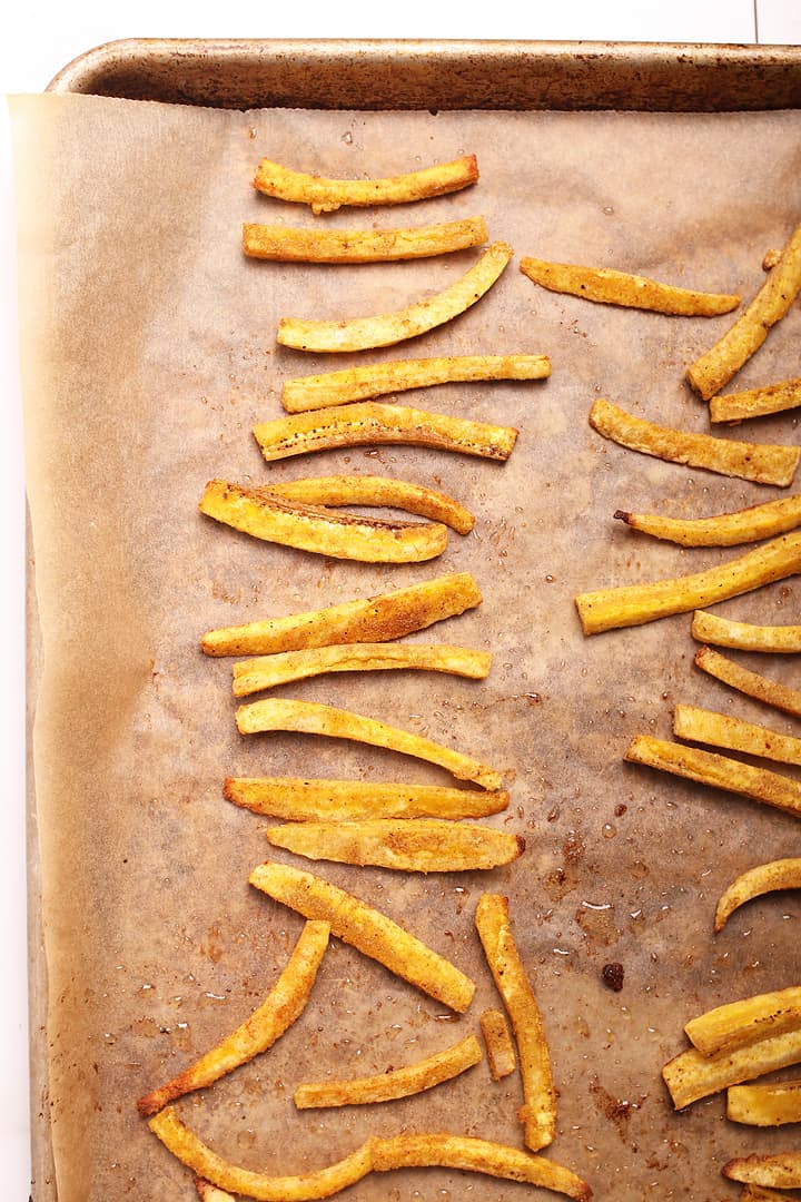 Plantain fries on a baking sheet