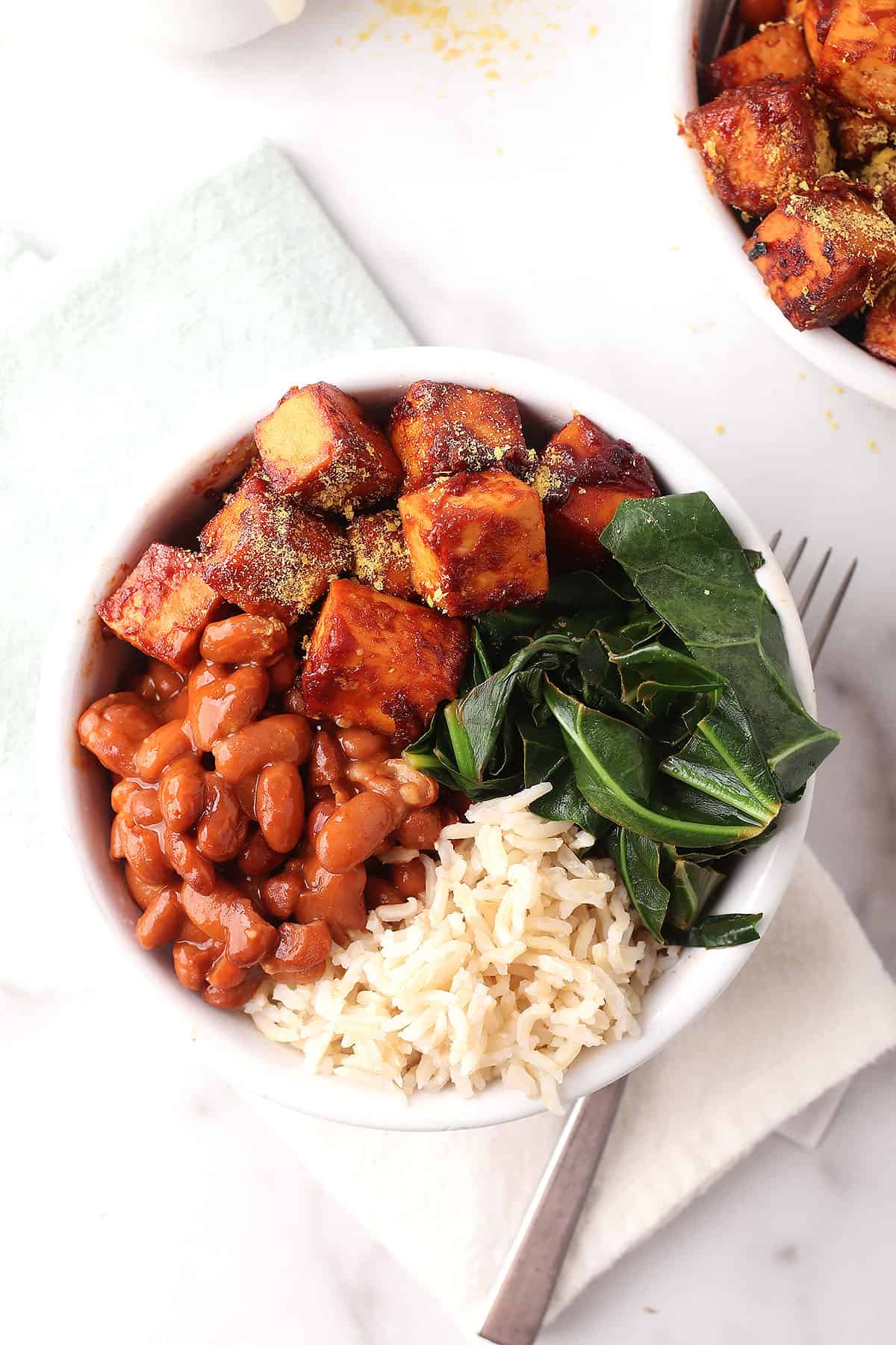 BBQ Tofu Bowl on white napkin with fork