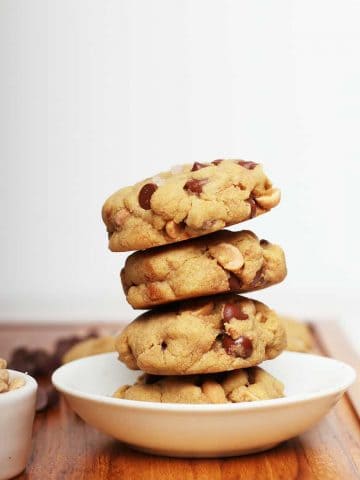 Stacked gluten free cookies in a white bowl