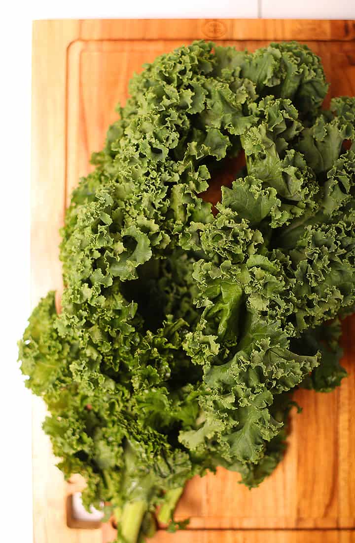 Curly kale on cutting board