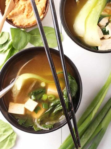 Miso soup in a black bowl