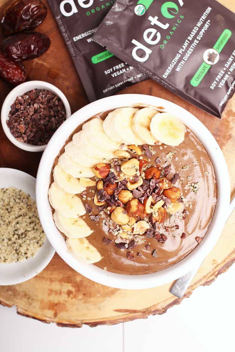 Overhead shot of finished smoothie bowl with fresh bananas