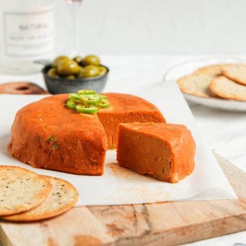 vegan cheddar cheese on cutting board