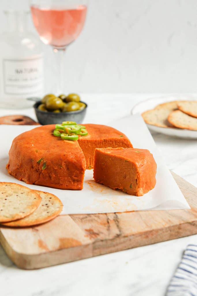 vegan cheddar cheese on cutting board