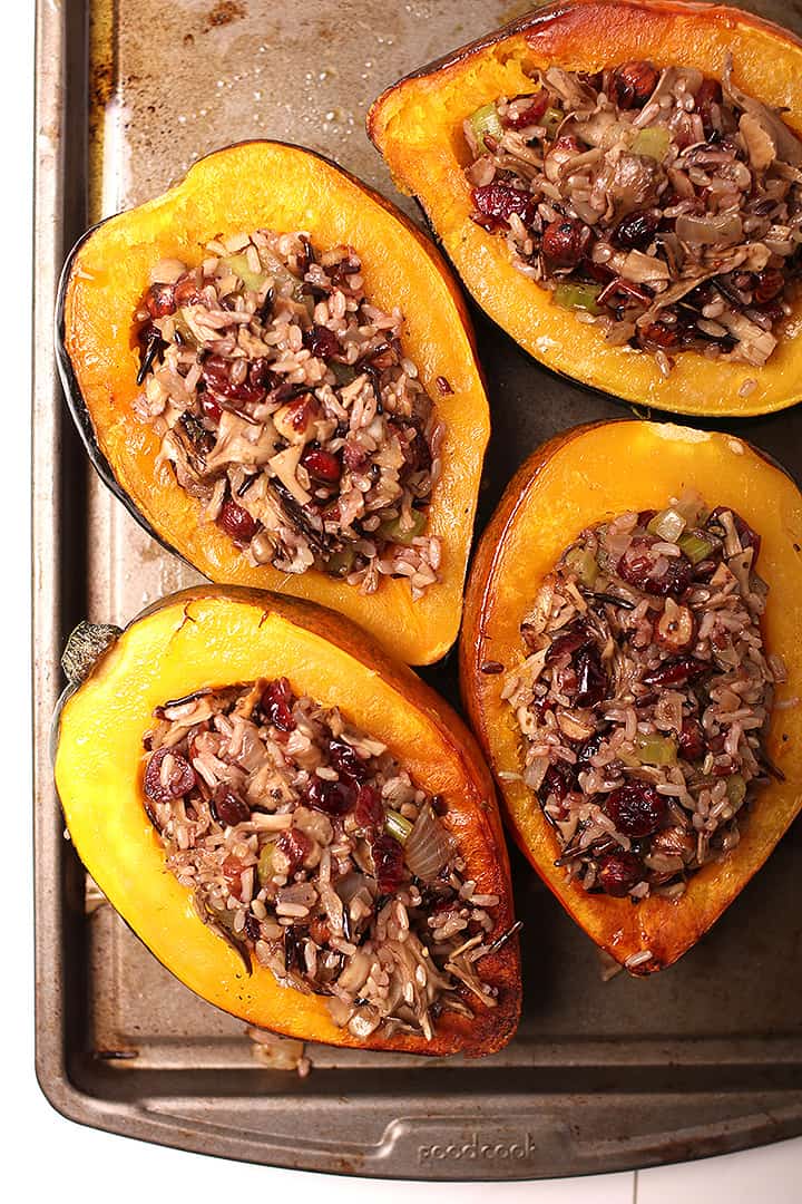 Wild Rice Stuffed Acorn Squash on a baking tray