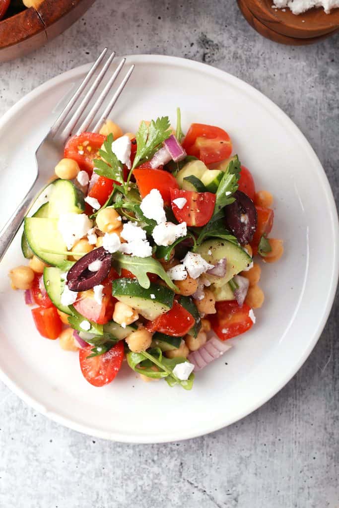 Finished Greek salad on a white plate