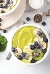 Close up of green smoothie bowl with bananas and blueberries