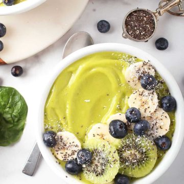 Close up of green smoothie bowl with bananas and blueberries