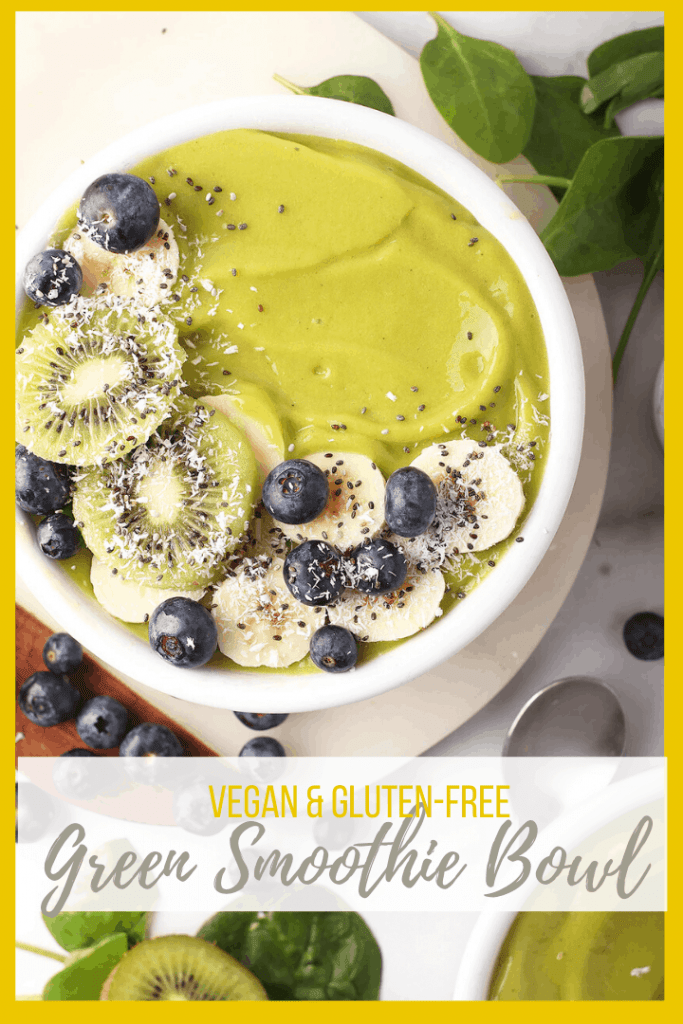 A Tropical Green Smoothie Bowl filled with mango, banana, and pineapple and topped with the BEST superfoods such as coconut and chia seeds. It's a refreshing and hearty meal that will fuel you up for hours.