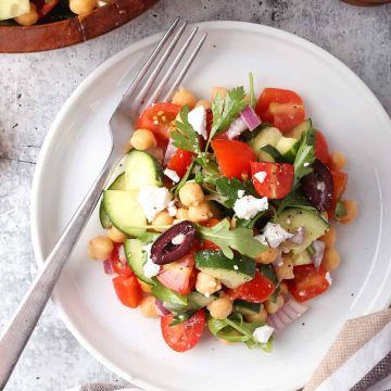 Finished Greek salad on a white plate