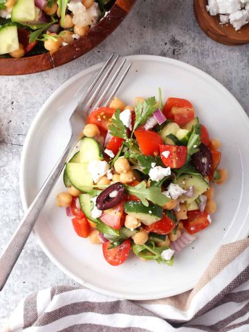 Finished Greek salad on a white plate