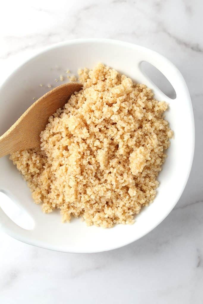 Cooked quinoa in a white bowl