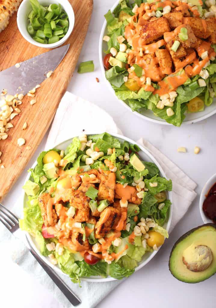 Two finished salad on marble background