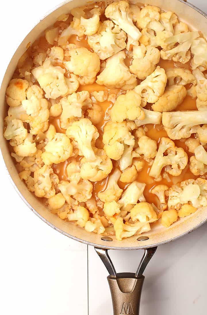 Cooked cauliflower florets in skillet