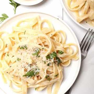 Vegan Fettuccine Alfredo on white plate