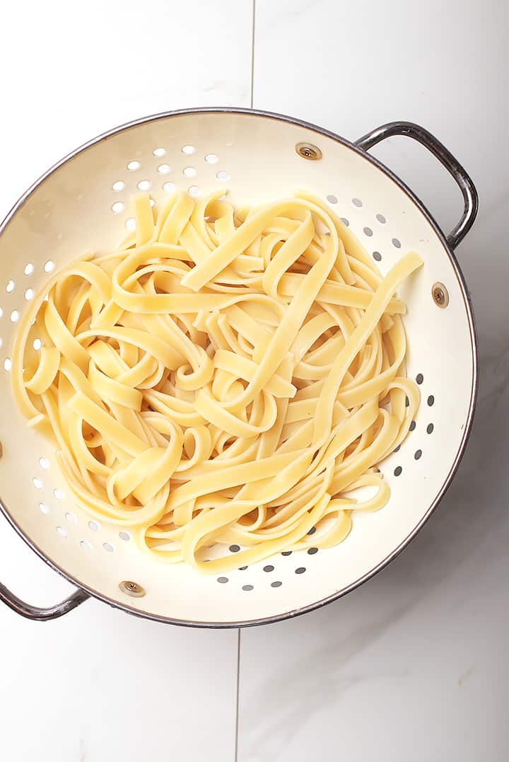 Fettuccine pasta in colander 