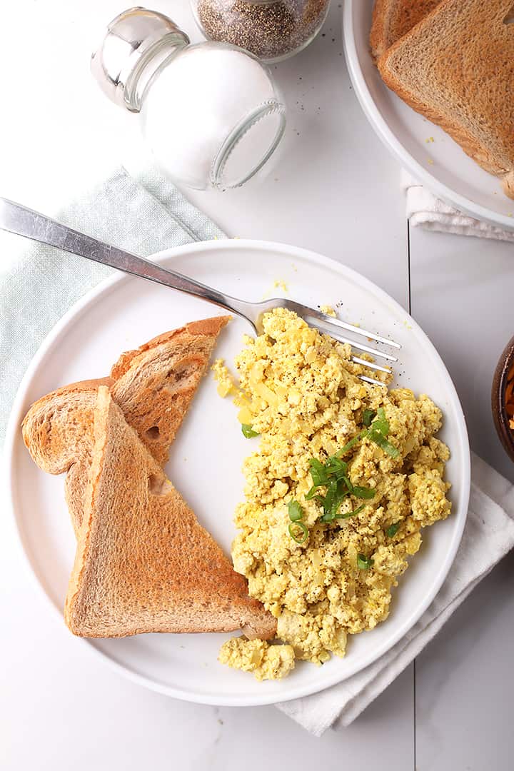 Finished dish with toast on white plate