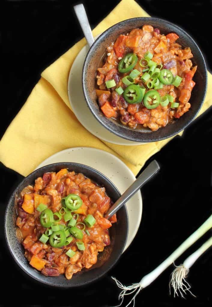 Two bowls of pumpkin tempeh chili