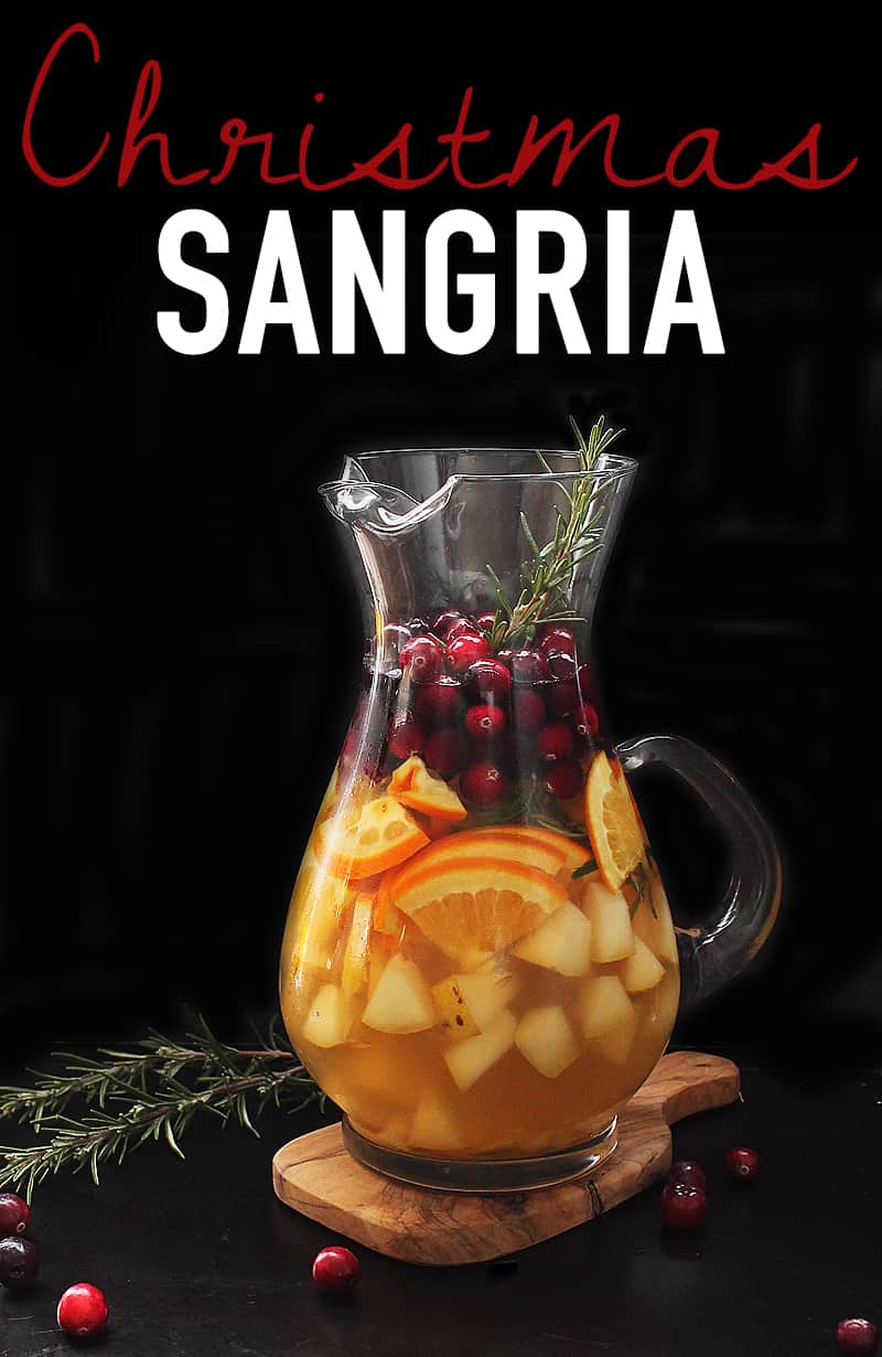 A Christmas Sangria flavored with blood oranges, fresh cranberries, and sprigs of rosemary for a festive twist on a classic beverage for a delicious holiday beverage. #christmas #sangria #mydarlingvegan
