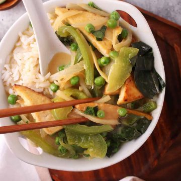 Bowl of Thai Green Curry with chop sticks