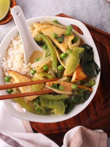 Bowl of Thai Green Curry with chop sticks