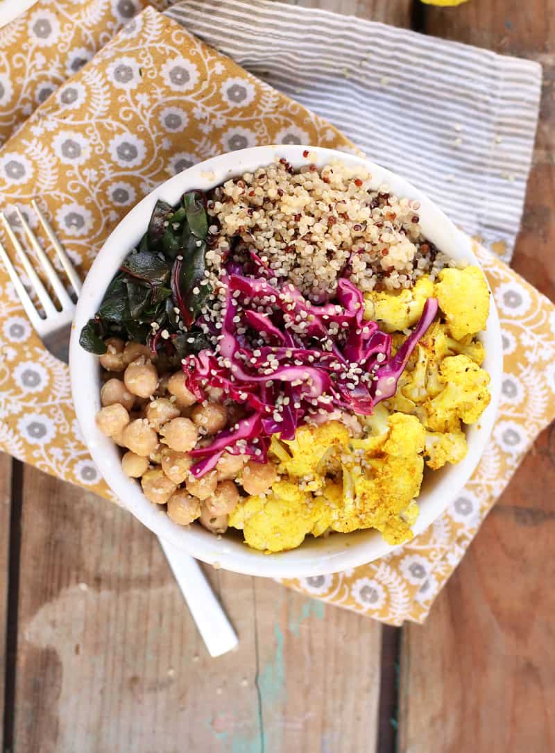 Roasted Cauliflower Bowls on a wooden background. 