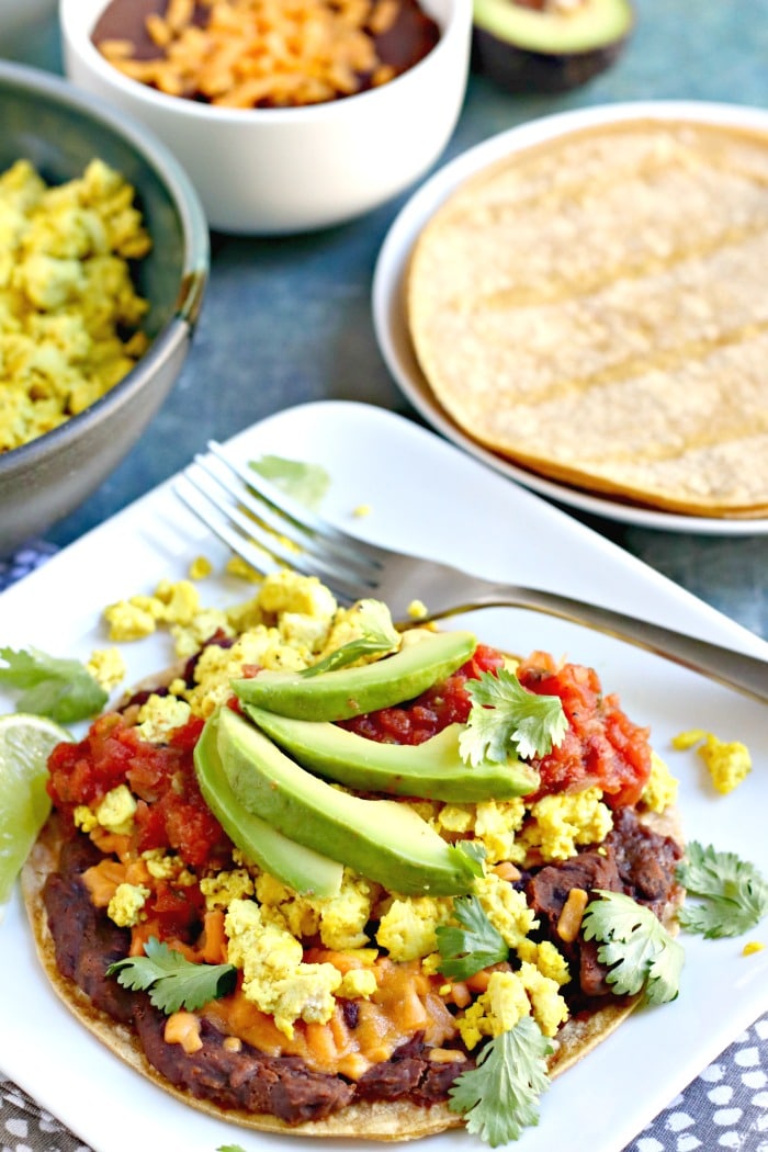 Vegan breakfast toastada with tofu eggs and avocado.