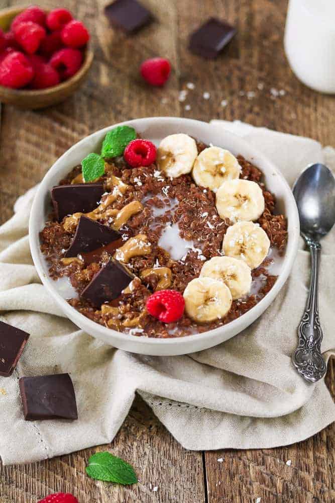 Chunky monkey breakfast quinoa bowl on a wooden background.