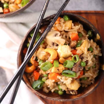 Finished dish in a wooden bowl with chopsticks