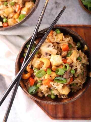 Finished dish in a wooden bowl with chopsticks