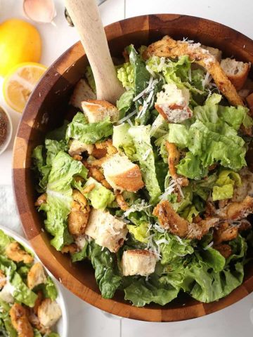 Vegan Caesar salad in wooden bowl