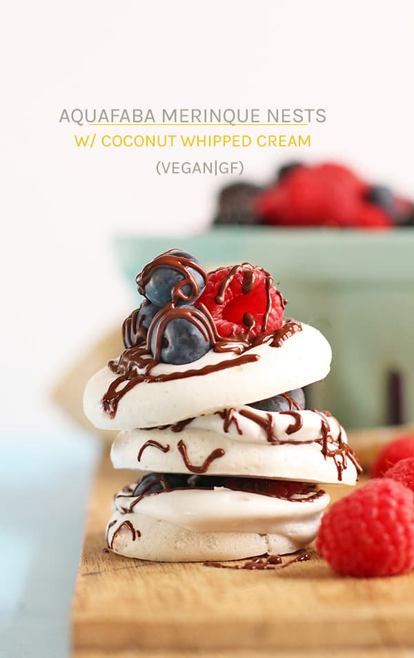 These Aquafaba Meringue Nests are made with coconut whipped cream, melted chocolate and fresh berries for a delicious vegan treat. #vegan #dessert #aquafaba #meringue #berries #spring #vegetarian #mydarlingvegan