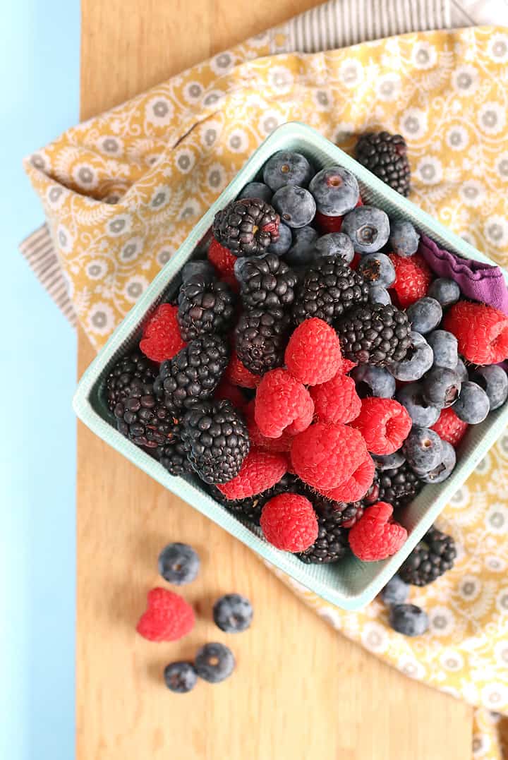Fresh berries on cutting board