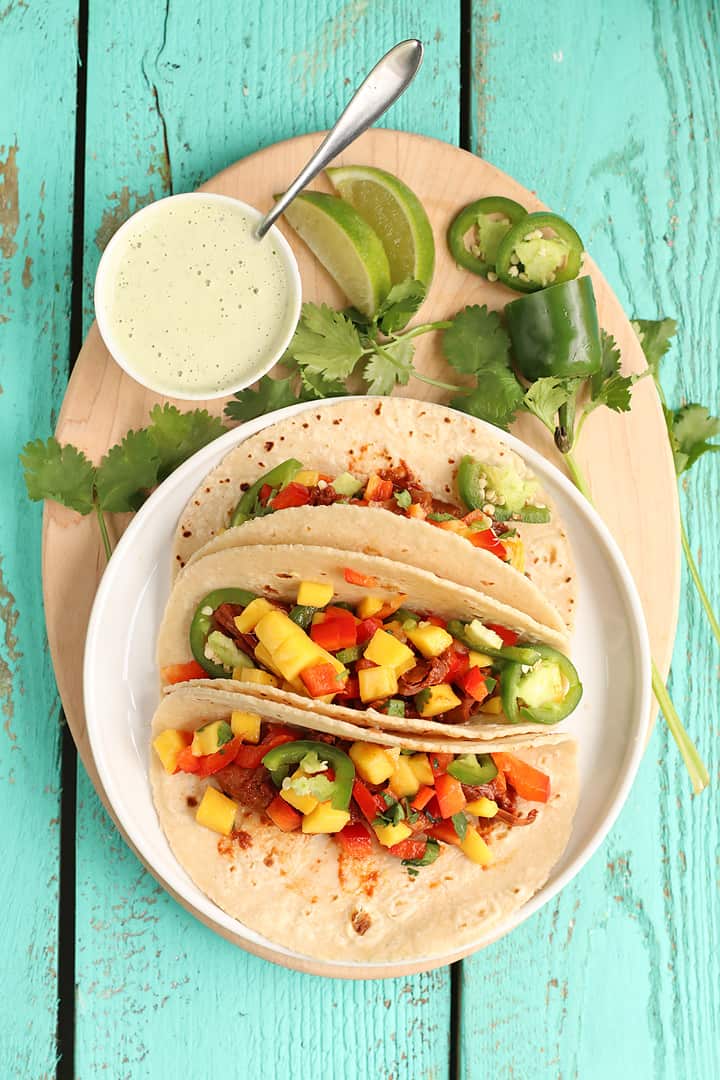 Finished tacos on an oval wood plate