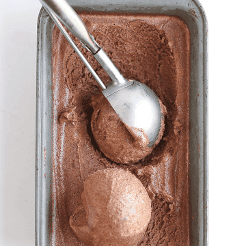 Chocolate Sorbet in a loaf pan with an ice cream scoop