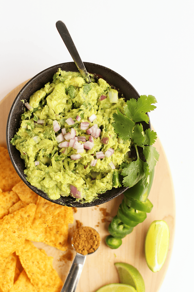 Homemade Guacamole in a small black bowl