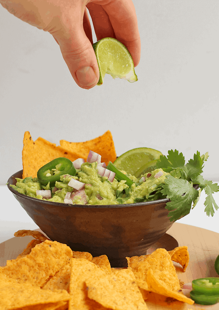 Finished dip in a black bowl with tortilla chips