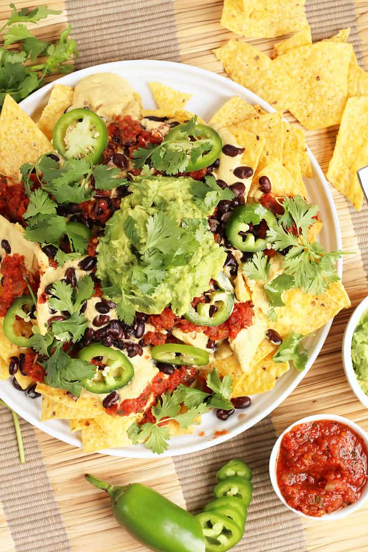 Finished plate of vegan nachos with fresh guacamole