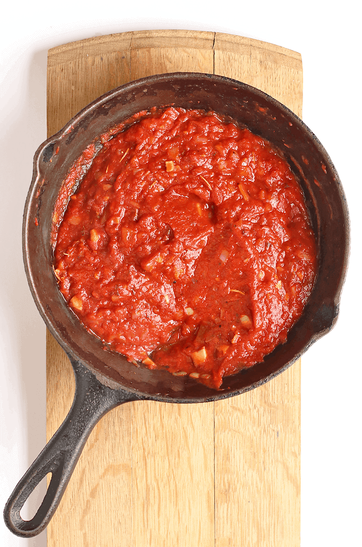 Homemade pizza sauce in a cast iron skillet